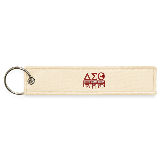 Delta Jet Tag Keychain - creme